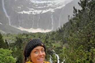 Hiker Grace Kelly discovered the breathtaking Cirque de Gavarnie in the French Pyrenees during a rainy trek, calling it a magical waterfall wonderland and her most unforgettable view.